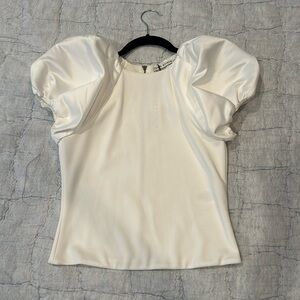 New with tags Alice and Olivia white shirt with big shoulders.